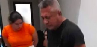 The security minister in handcuffs.