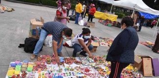 artisan vendors at Cholula tianguis displaying wares