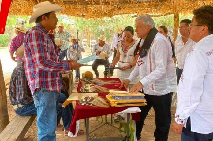 The president meets with Yaqui representatives last August in Sonora.