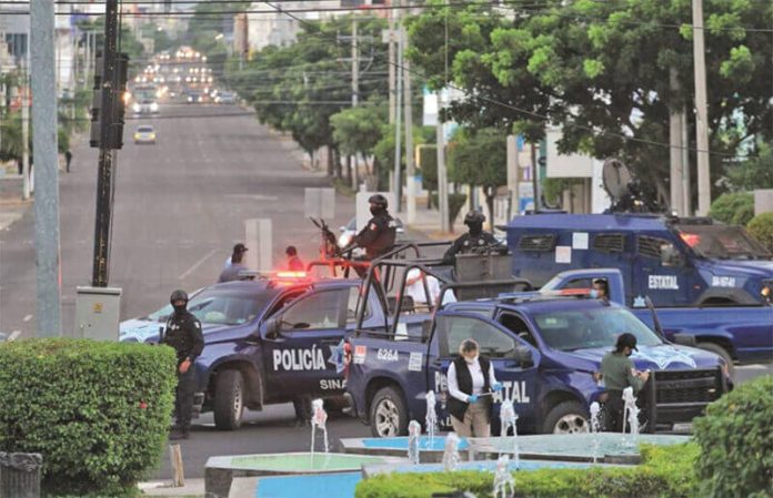 The police pursuit of the gunmen was foiled when the vandals threw metal spikes onto the road that punctured the tires of two police cars.
