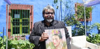 Editor and co-author Lozano with a copy of the new book.