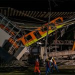 Firefighters and Civil Protection personnel work at the site of the Mexico City metro accident in May.