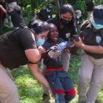 Immigration agents drag a screaming youngster out of the woods in Chiapas on Thursday.