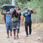 Haitian migrants on the road.