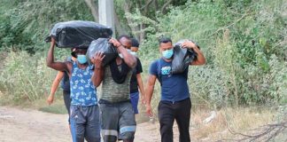 Haitian migrants on the road.