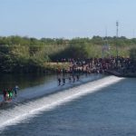 Migrants make their way across the Rio Grande near Ciudad Acuña.