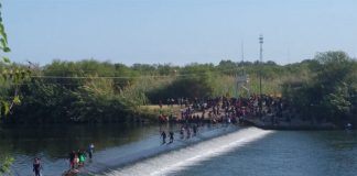 Migrants make their way across the Rio Grande near Ciudad Acuña.