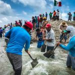 Residents of San Dionisio del Mar relieve flooding