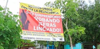 'If we catch you stealing you will be lynched!' warns a sign