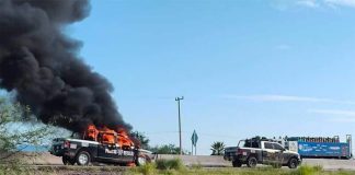 A police vehicle burns in Altar.