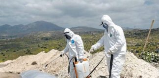 Tijuana cemetery staff prepare to bury a COVID victim whose body went unclaimed in 2020.