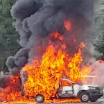 A delivery truck burns at a highway blockade in Michoacán