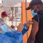 A migrant is vaccinated in Tijuana last month.