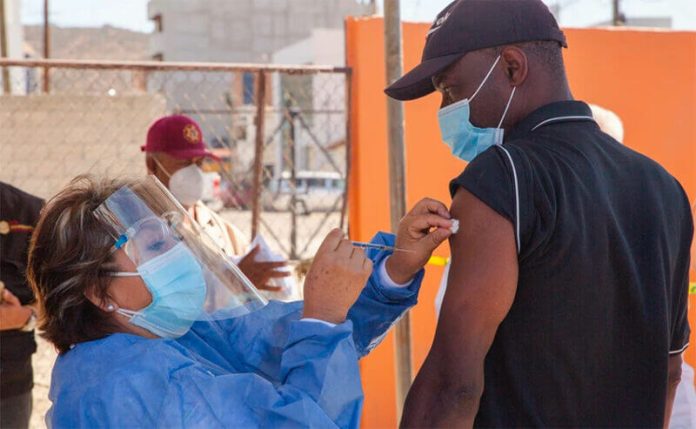 A migrant is vaccinated in Tijuana last month.