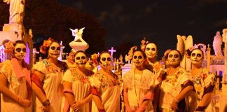 Women in Catrina makeup and Yucatán huipils