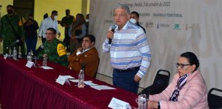 The president addresses a noisy crowd in Puebla on Sunday.