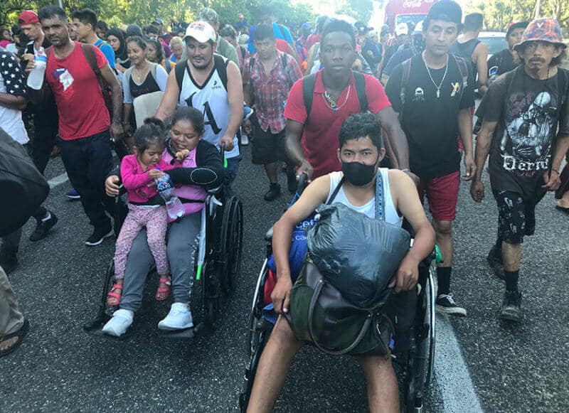 Wheelchair-bound migrants on the road in Chiapas.