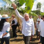 The president waves to onlookers during a visit to Chiapas Monday