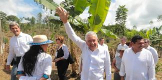 The president waves to onlookers during a visit to Chiapas Monday
