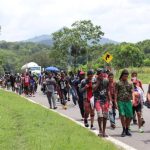 A group of migrants makes their way through Chiapas on a hot day in August of this year.