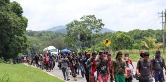 A group of migrants makes their way through Chiapas on a hot day in August of this year.