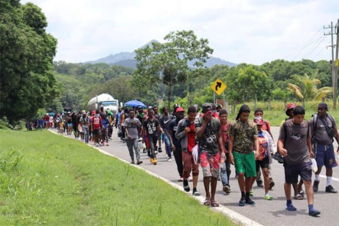 A group of migrants makes their way through Chiapas on a hot day in August of this year.