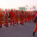 Workers line up for their shift at the Tabasco refinery.