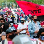 Teachers protest unpaid salaries at a march in September.