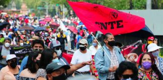 Teachers protest unpaid salaries at a march in September.