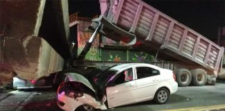 The truck, the taxi and the fallen overpass.