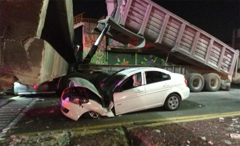 The truck, the taxi and the fallen overpass.