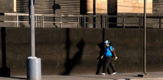 Despite the decline in cases, many pedestrians and drivers are still faithfully masking up.