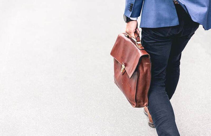 man in suit with briefcase