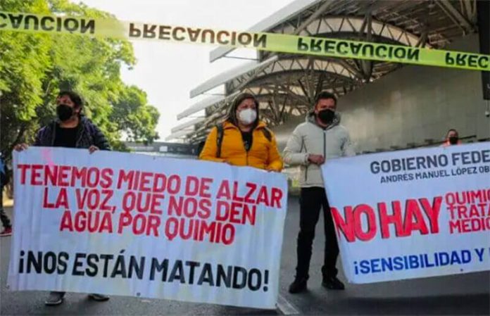 Parents of children with cancer protested at the Mexico City airport on Tuesday.