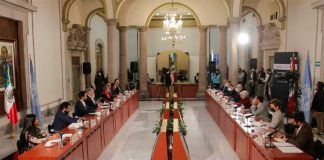 Committee members meet with government representatives in Mexico City on Monday.