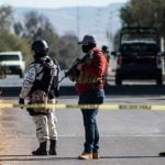 Security forces on patrol at Thursday's crime scene.