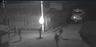 Cartel hitmen in the streets of Villa Victoria