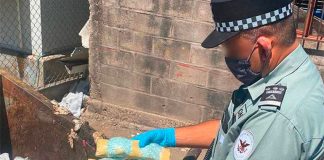 A National Guardsman with confiscated bags of fentanyl.