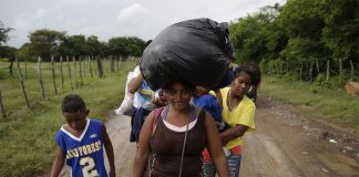 A group of Honduran migrants on the border of Honduras and El Salvador heading north in 2018.