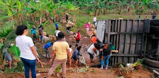 People help themselves to cargo after one of the accidents.