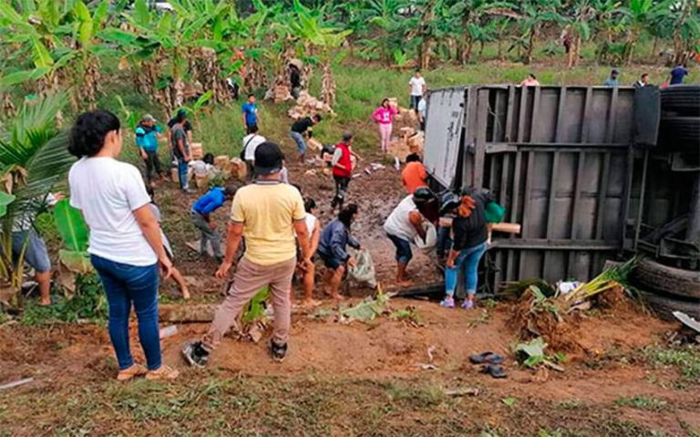 People help themselves to cargo after one of the accidents.