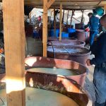 Security officials examine a seized narco lab.