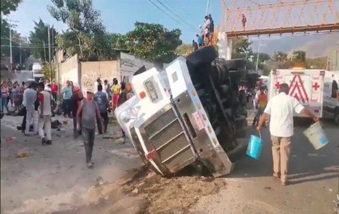 The truck lies on its side after last week's crash in Chiapas.