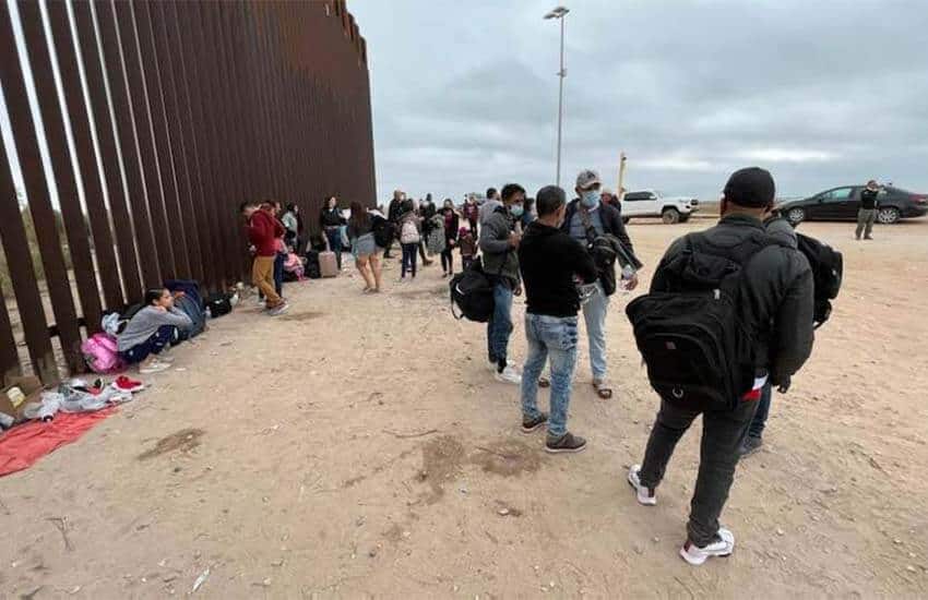 Migrants at Yuma border wall