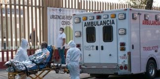 An elderly man with symptoms of COVID arrives at the hospital.