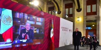 The president speaks to Tuesday morning's press conference via a video link.