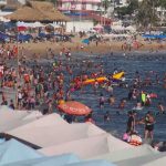 filled Acapulco beach 2022