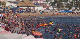 filled Acapulco beach 2022
