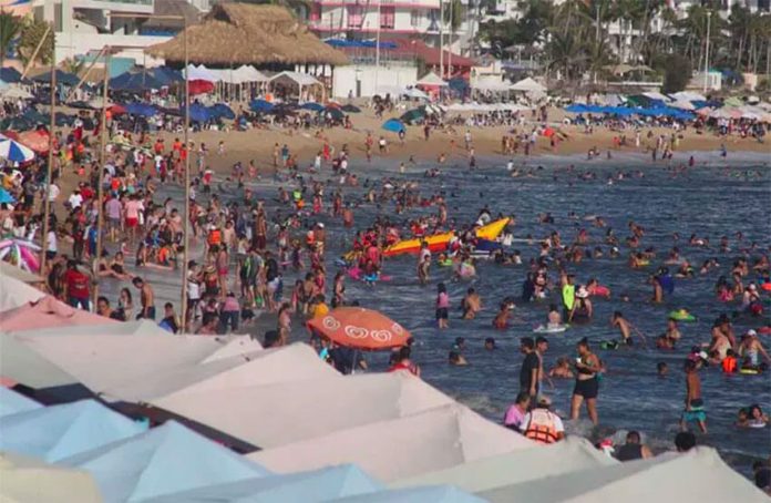 filled Acapulco beach 2022