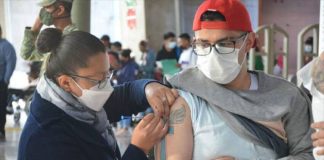 A man in Mexico City receives a coronavirus vaccination.